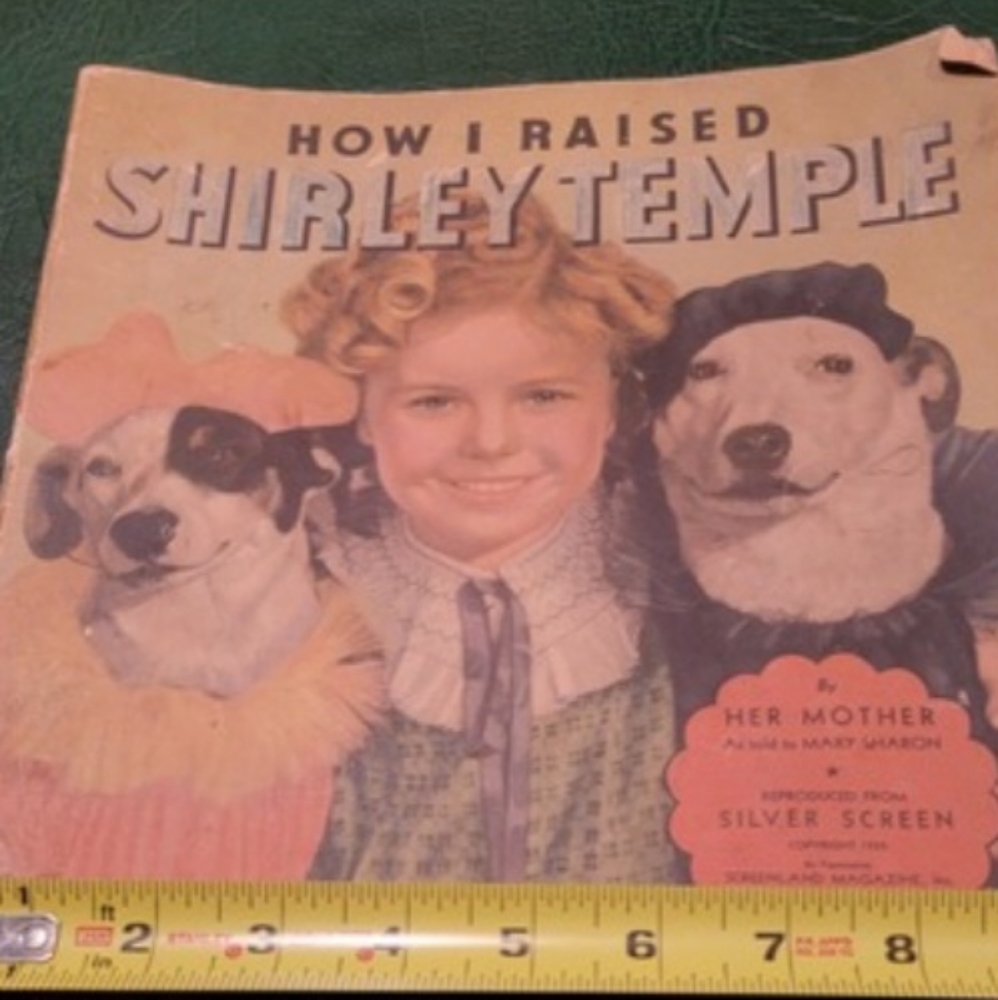Shirley Temple book and souvenir blue glass cup. Book copyright 1935